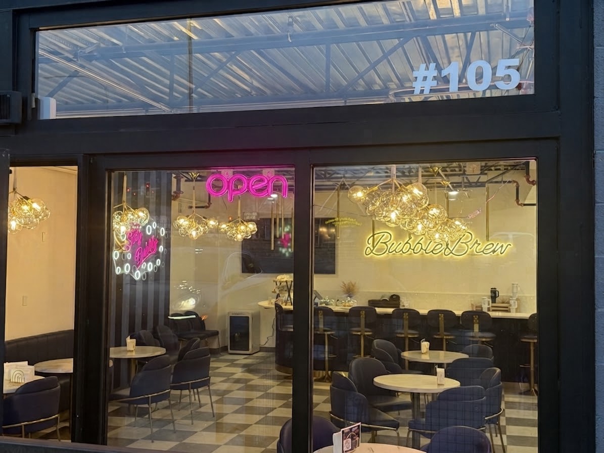 BubbleBrew storefront at twilight with its illuminated sign